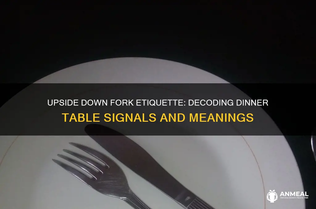 what does an upside down fork at dinner mean