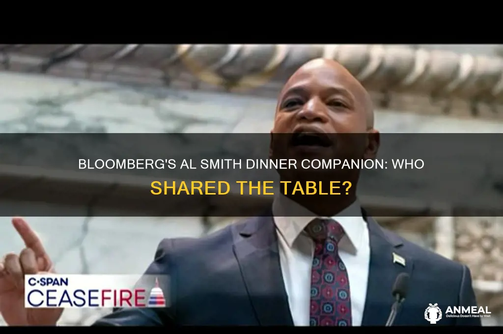 who is sitting next to bloomberg at al smith dinner