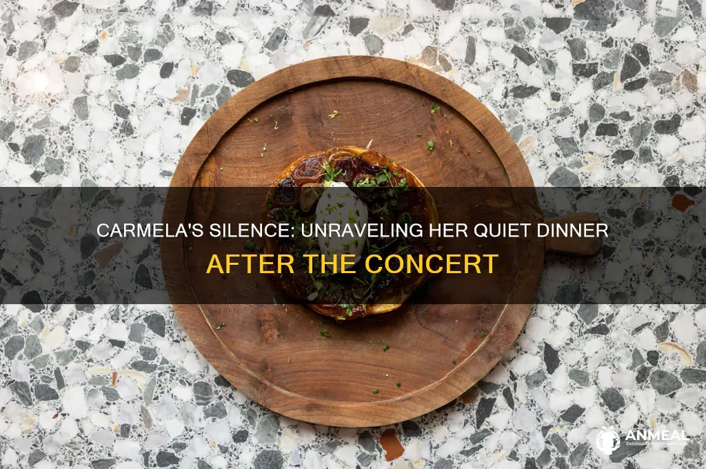 why was carmela quiet at dinner after concert